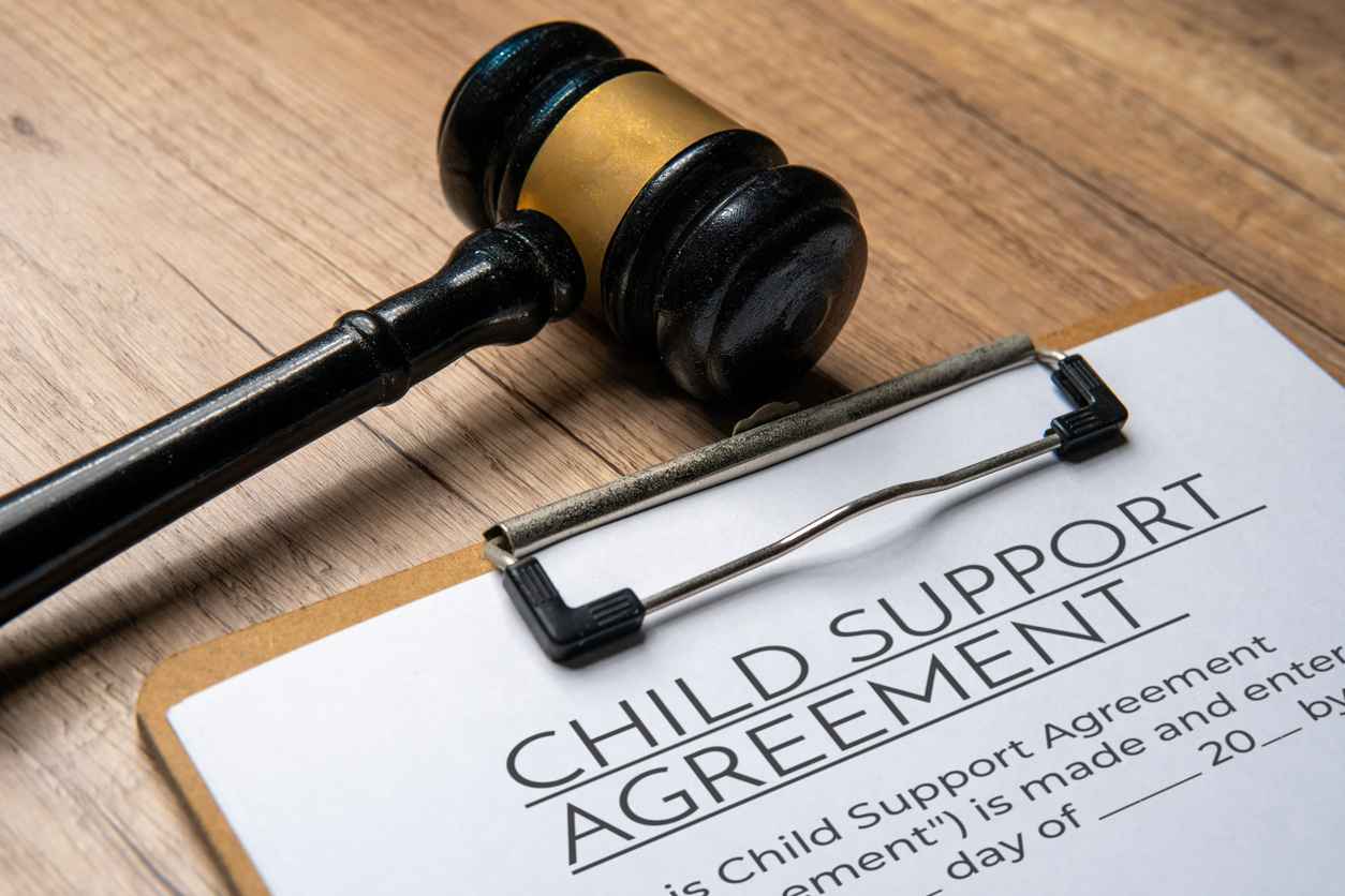 A gavel on a child support agreement document. Legal concept.